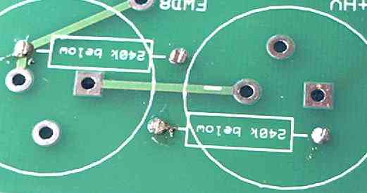 Cut the resistor leads flush to the surface of the board's TOP side.